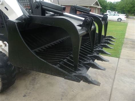 bobcat skid steer release bucket|cool bobcat skid steer attachments.